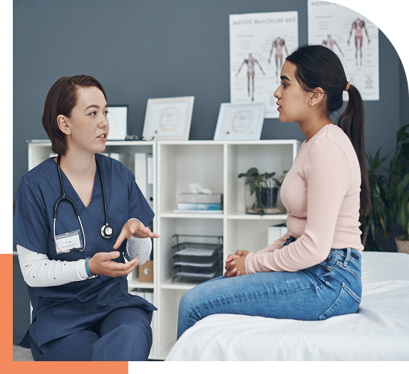 Doctor consulting with a patient in clinic.